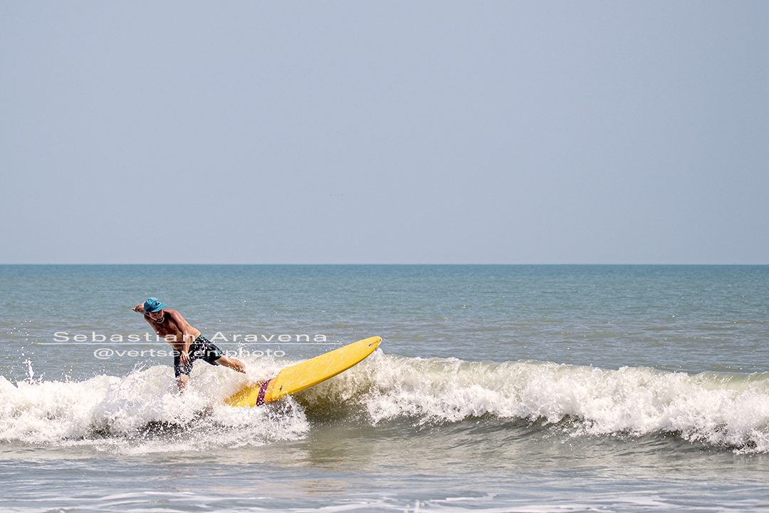 Only a Few Surfers Riding Small Waves at Satellite Beach on a Sunny Afternoon