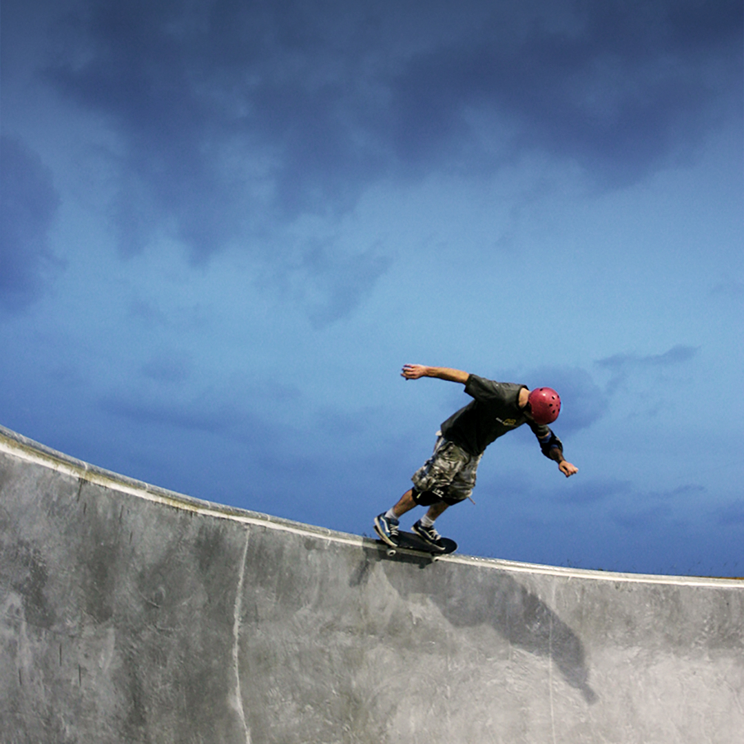 Photograph of skateboarder grinding on the coping of the deep end at the Cocoa Beach Skatepark. Photograph by Sebastian Aravena