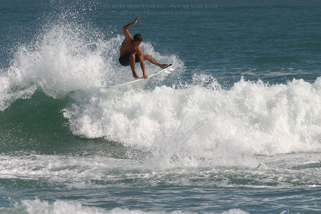 Photograph of surfer catching air at Sebastian Inlet, Florida in 2007. Photograph by Sebastian Aravena